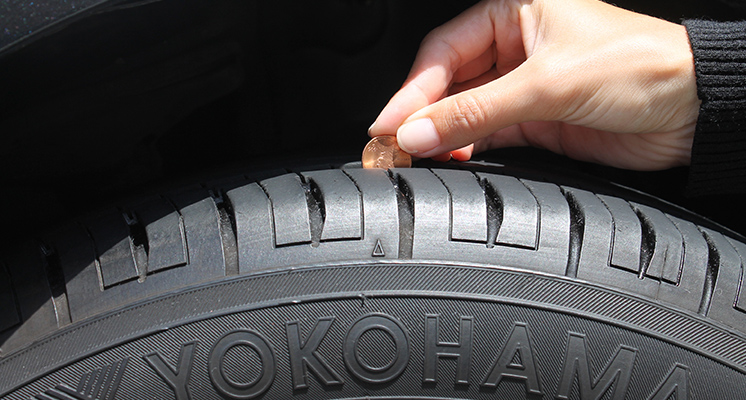 Coin in tire tread